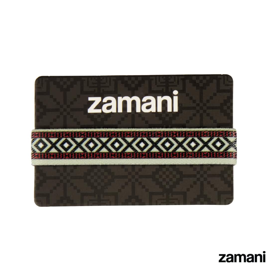A zamani wristband presented on its printed card